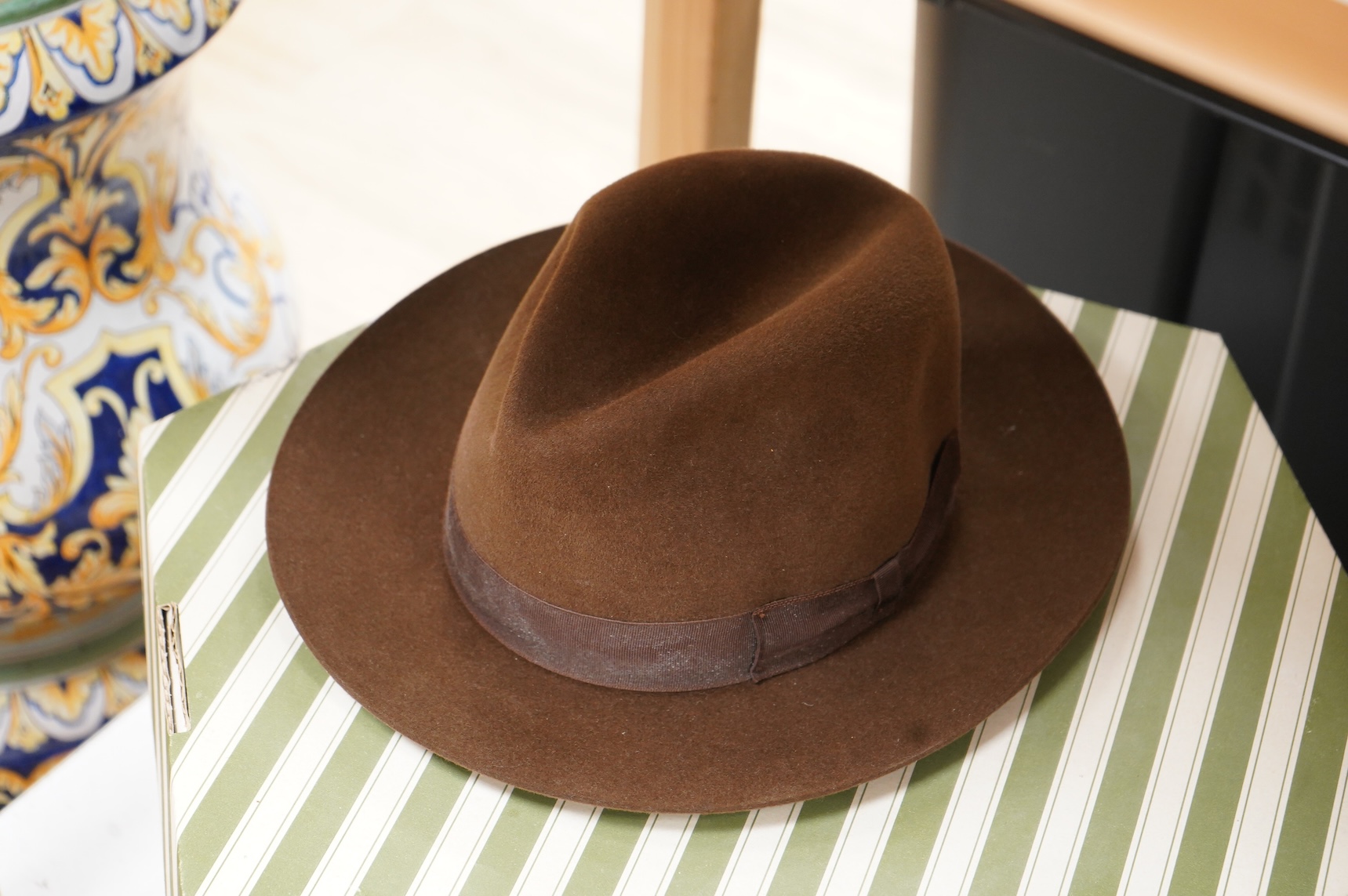 Two hat boxes containing five gentleman's hats; three Fedoras by Locke, Christy’s and Herbert Johnson and two straw Panamas, one by Bates.